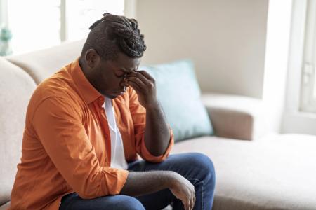 Young man contemplating what it means to deny yourself as he seeks the discipline to surrender his priorities and live with a commitment to discipleship without fear