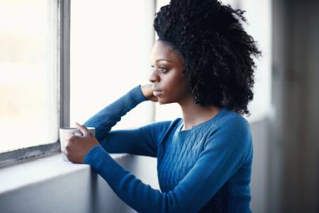 woman contemplating who will Jesus be in your life knowing it means an increase in commitment and discipleship, reordinering her priorities to be on mission in humility and no pride